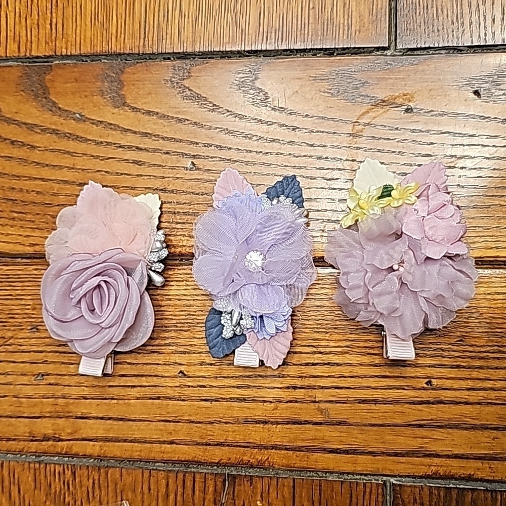 3 cute hair clips in mostly purple